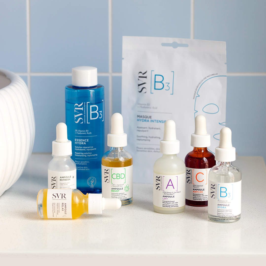 SVR Ampoule Lift serum bottle with dropper, surrounded by various SVR skincare products on a white surface.