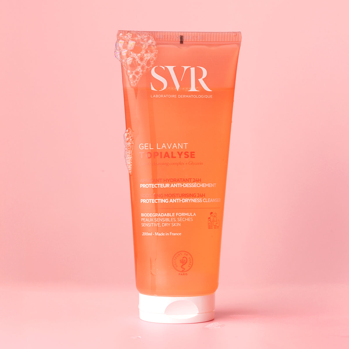 Transparente 200ml Tube SVR Topialyse Gel Lavant mit Schaum auf rosa Hintergrund.